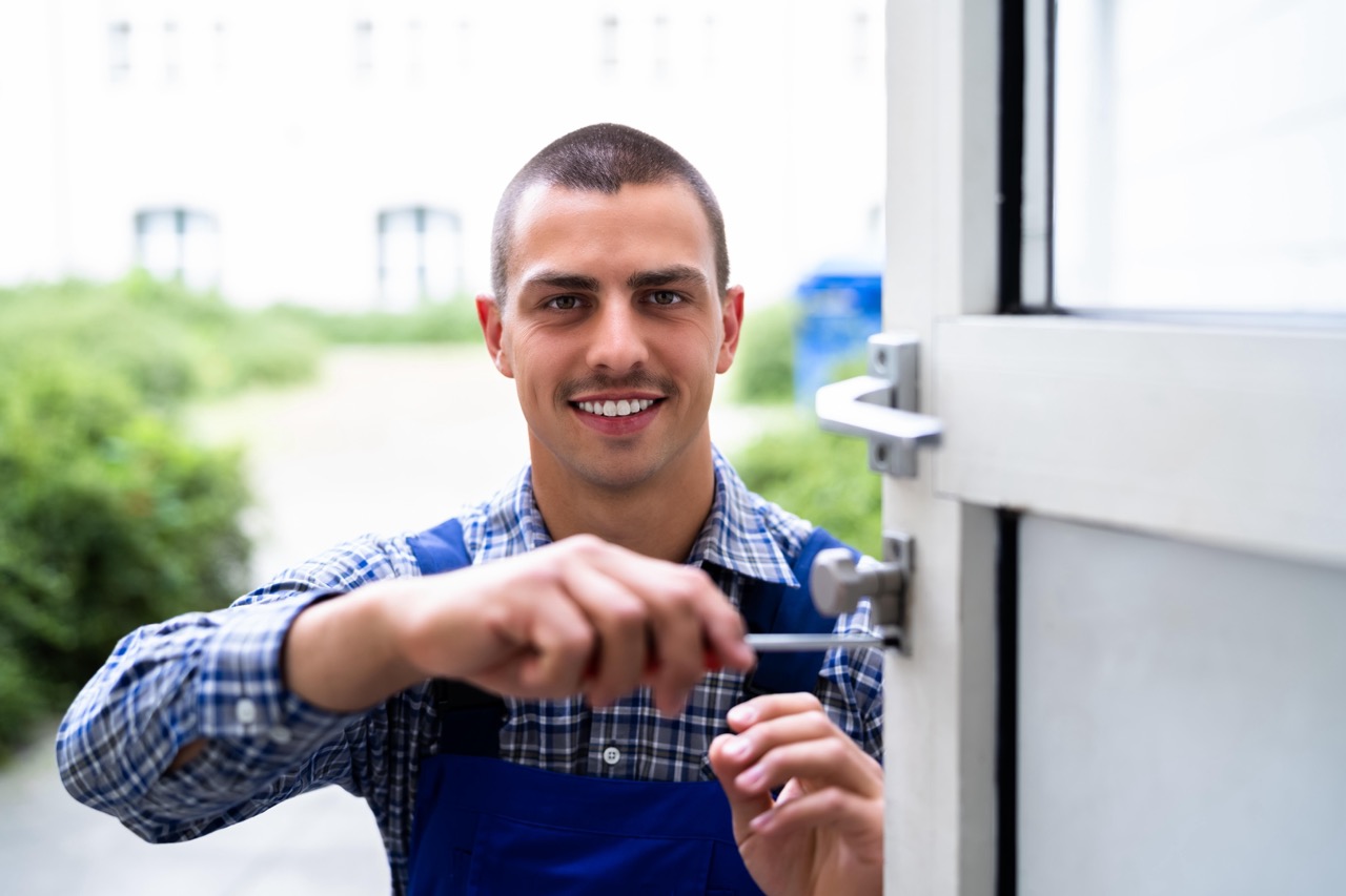 Locksmith Lock Door Repair. Worker Changing